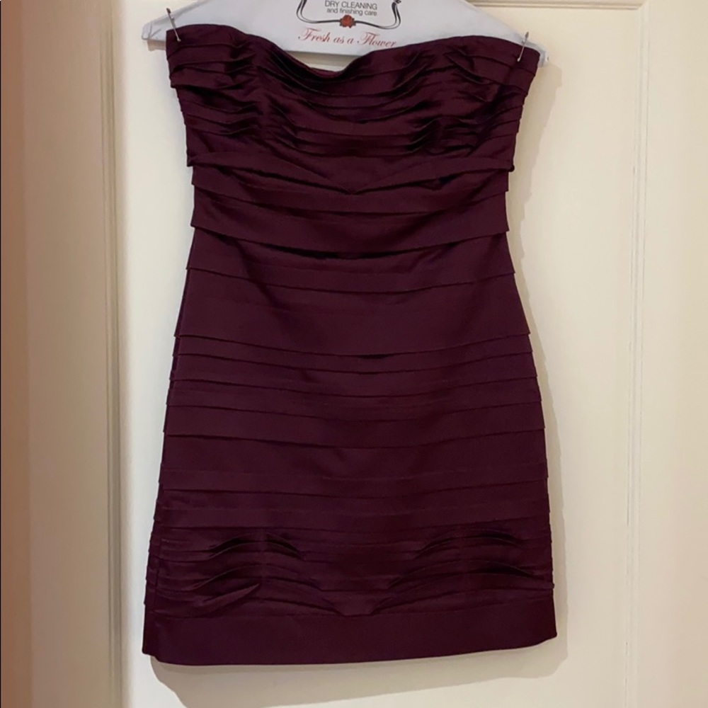 Form fitting purple pleated dress